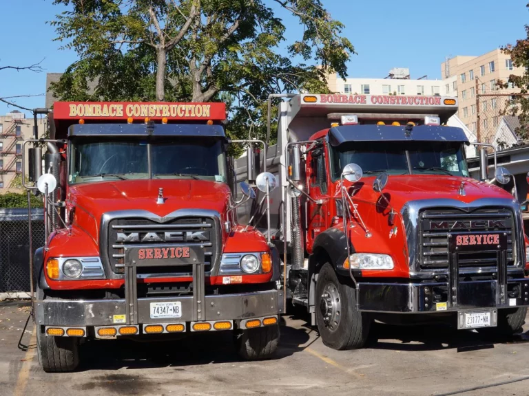 bombace construction two red dump trucks