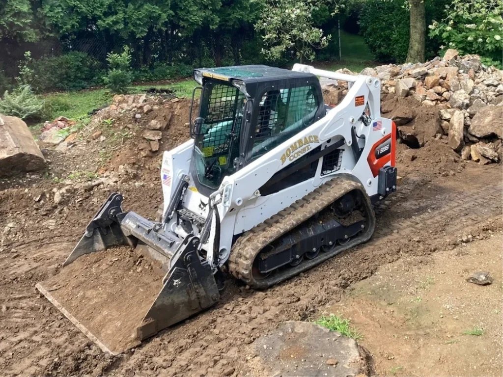 A Bombace Construction compact track loader grading and clearing a residential property in New Rochelle, NY.